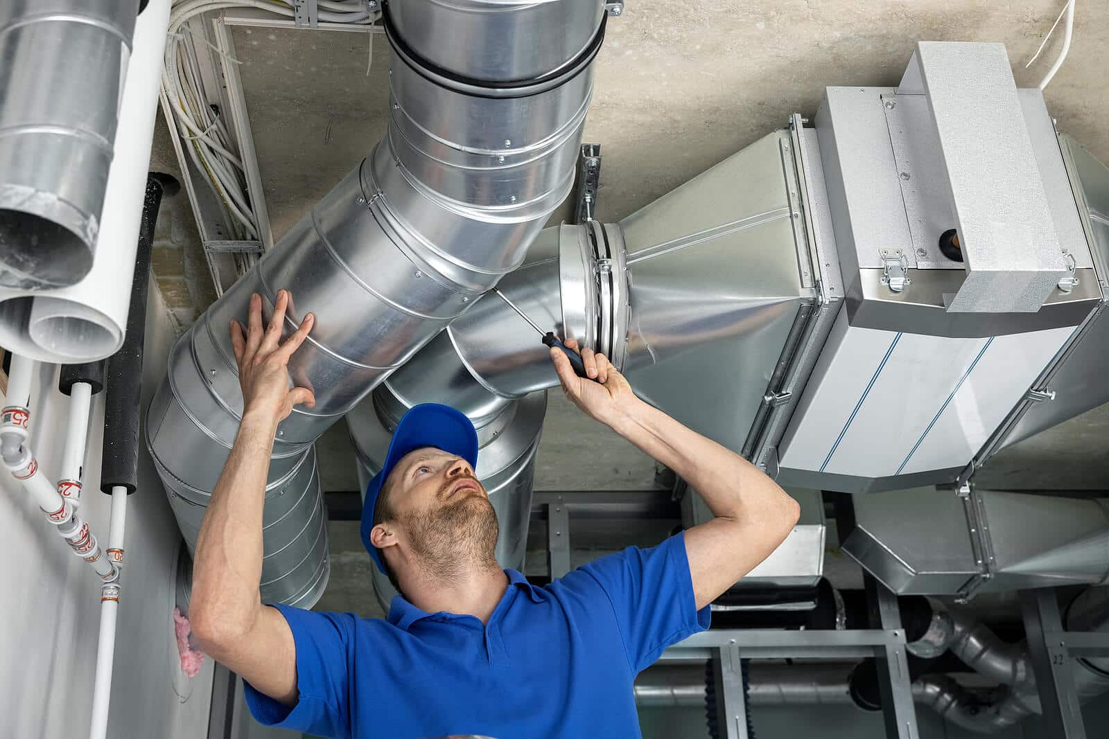 HVAC technician inspecting and repairing air ducts in Santa Monica