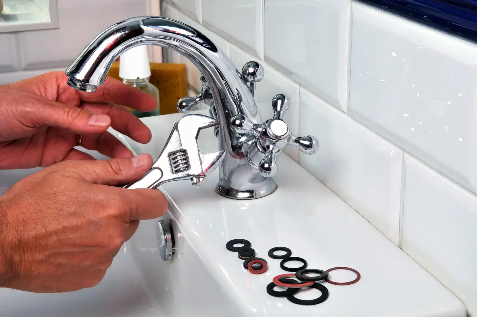 Plumber maintaining a bathroom faucet in Santa Monica