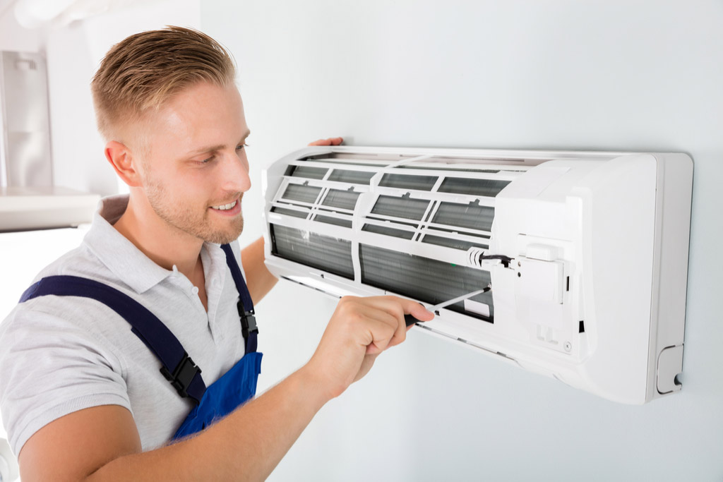 HVAC technician maintaining a ductless air conditioner in Santa Monica