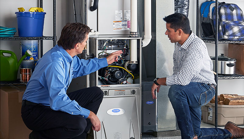 Technician evaluating a furnace for repair or replacement in Santa Monica