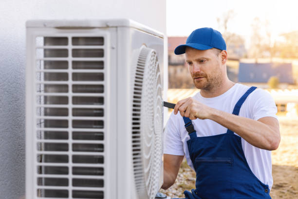 HVAC technician servicing an outdoor air conditioner in Santa Monica
