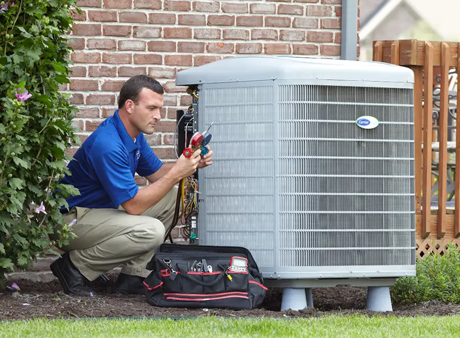 HVAC technician inspecting an outdoor AC unit in Santa Monica